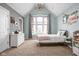 Cozy bedroom featuring a statement chandelier, large window, and neutral color palette at 13888 Smokey Ridge Dr, Carmel, IN 46033