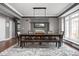 Dining room with a large table and elegant lighting fixture at 13888 Smokey Ridge Dr, Carmel, IN 46033