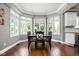Bright dining area with bay windows and hardwood floors, perfect for entertaining guests at 13888 Smokey Ridge Dr, Carmel, IN 46033