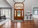 Grand foyer with a high ceiling and beautiful wood door at 13888 Smokey Ridge Dr, Carmel, IN 46033