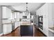 Elegant kitchen featuring a central island, granite countertops, and modern stainless steel appliances at 13888 Smokey Ridge Dr, Carmel, IN 46033