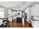 Stylish kitchen with white cabinetry, granite countertops, and a large island with stainless appliances at 13888 Smokey Ridge Dr, Carmel, IN 46033