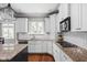 Close-up of kitchen with granite counters, stainless appliances, and ample cabinet space at 13888 Smokey Ridge Dr, Carmel, IN 46033