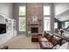 Cozy living room with a brick fireplace and comfortable seating at 13888 Smokey Ridge Dr, Carmel, IN 46033