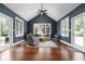 Inviting living room featuring vaulted ceilings, hardwood floors, and natural light from large windows at 13888 Smokey Ridge Dr, Carmel, IN 46033