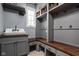 Organized mudroom with built-in storage, bench seating, and convenient sink area at 13888 Smokey Ridge Dr, Carmel, IN 46033