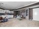 Spacious basement playroom featuring custom built-in shelving, cabinetry, and plenty of open space for play at 13888 Smokey Ridge Dr, Carmel, IN 46033