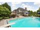 Inground pool with diving board and patio furniture surrounded by a spacious yard at 13888 Smokey Ridge Dr, Carmel, IN 46033
