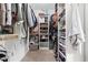 Organized walk-in closet with shelving and ample storage space for clothing and accessories at 13888 Smokey Ridge Dr, Carmel, IN 46033