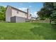 Expansive backyard featuring a well-maintained lawn and a charming wood deck for outdoor enjoyment at 13938 Charleswood Ct, Fishers, IN 46038
