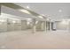 Large finished basement featuring support beams, neutral carpet, and ample lighting at 13938 Charleswood Ct, Fishers, IN 46038