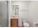 This bathroom features a sink with a wooden cabinet, a toilet, and a shower at 13938 Charleswood Ct, Fishers, IN 46038
