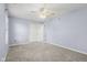 Bedroom featuring neutral carpet, a ceiling fan, and a double door closet at 13938 Charleswood Ct, Fishers, IN 46038