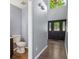 Welcoming foyer featuring luxury vinyl plank flooring, a powder room, and a decorative front door at 13938 Charleswood Ct, Fishers, IN 46038