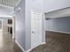 Open hallway leading to a bright living area with luxury vinyl plank flooring throughout at 13938 Charleswood Ct, Fishers, IN 46038