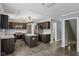 Modern kitchen with stainless steel appliances, an island, and dark cabinetry at 13938 Charleswood Ct, Fishers, IN 46038