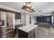 Modern kitchen with stainless steel appliances, a center island, and an open layout to the living area at 13938 Charleswood Ct, Fishers, IN 46038
