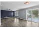 Spacious living room featuring new flooring, sliding glass doors to the deck, and neutral paint at 13938 Charleswood Ct, Fishers, IN 46038