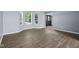 Open-concept living room featuring new floors and neutral colored walls at 13938 Charleswood Ct, Fishers, IN 46038
