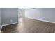 Bright open living room featuring modern light fixture and beautiful wood-look flooring at 13938 Charleswood Ct, Fishers, IN 46038