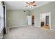 Spacious bedroom includes a ceiling fan and an en-suite bathroom at 13938 Charleswood Ct, Fishers, IN 46038