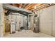 Basement utility room with water heater, water softener, and HVAC equipment at 13938 Charleswood Ct, Fishers, IN 46038