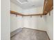 Walk-in closet includes ample shelving and space for organization at 13938 Charleswood Ct, Fishers, IN 46038