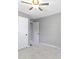 Bedroom with soft gray walls, neutral carpet, two closets, and ceiling fan at 141 S 9Th Ave, Beech Grove, IN 46107