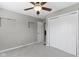 Bright bedroom with neutral carpet, closet, and a ceiling fan for added comfort at 141 S 9Th Ave, Beech Grove, IN 46107