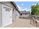 Enjoy outdoor living on this home's deck, featuring a white door and matching trim at 141 S 9Th Ave, Beech Grove, IN 46107