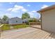 A spacious deck extends from this home into the backyard, offering space to relax at 141 S 9Th Ave, Beech Grove, IN 46107
