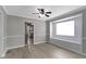 Dining room featuring laminate flooring, natural lighting, neutral walls and view into the kitchen at 141 S 9Th Ave, Beech Grove, IN 46107