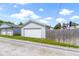This home includes a detached two-car garage accessible via a gravel driveway at 141 S 9Th Ave, Beech Grove, IN 46107