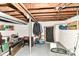 This basement has exposed pipes, utilities, and plenty of room for storage at 1619 E Bradbury Ave, Indianapolis, IN 46203
