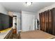 This bedroom has carpeted floors, a large bed, a dresser, and a closet with sliding doors and plenty of room at 1619 E Bradbury Ave, Indianapolis, IN 46203