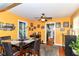 Cozy dining room featuring an area rug, a ceiling fan and bright walls at 1619 E Bradbury Ave, Indianapolis, IN 46203