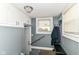 This home has an entryway with an exterior door, stairs, a bench, and a window at 1619 E Bradbury Ave, Indianapolis, IN 46203