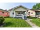 Adorable single-Gathering residence with a welcoming front porch and sidewalk at 1619 E Bradbury Ave, Indianapolis, IN 46203