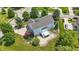 An aerial view of a well-kept two story home with a landscaped yard and backyard deck at 16802 Oak Manor Dr, Westfield, IN 46074