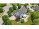 An aerial view of a home with a landscaped yard, long drive, and a backyard deck at 16802 Oak Manor Dr, Westfield, IN 46074