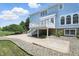 Backyard patio with concrete slab and upper level deck off a two-story home at 16802 Oak Manor Dr, Westfield, IN 46074