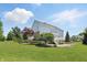 Expansive backyard with lush lawn, mature trees, and a spacious deck for entertaining at 16802 Oak Manor Dr, Westfield, IN 46074