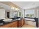 Bright bathroom featuring double sinks, a soaking tub, and a glass-enclosed shower with tiled walls at 16802 Oak Manor Dr, Westfield, IN 46074