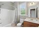 Bathroom with bathtub, toilet, and vanity sink, complemented by neutral walls and tiled floors at 16802 Oak Manor Dr, Westfield, IN 46074