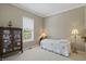 Cozy bedroom with neutral walls, carpet flooring, natural light, and antique furniture at 16802 Oak Manor Dr, Westfield, IN 46074