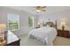 Light and airy bedroom with white bedding, neutral walls, and natural light at 16802 Oak Manor Dr, Westfield, IN 46074