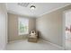Bright bedroom with carpet flooring, natural light, neutral walls, and a cozy armchair at 16802 Oak Manor Dr, Westfield, IN 46074