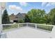 White composite deck with scenic views of lush greenery and neighboring homes at 16802 Oak Manor Dr, Westfield, IN 46074