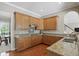 Gourmet kitchen featuring granite countertops, custom cabinets, and modern appliances, ideal for culinary enthusiasts at 16802 Oak Manor Dr, Westfield, IN 46074