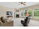 Spacious living room with neutral walls, fireplace, plush sofa, and abundant natural light at 16802 Oak Manor Dr, Westfield, IN 46074